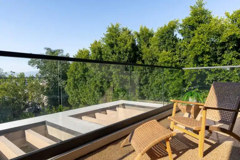 Balcony seating overlooking lush green landscape