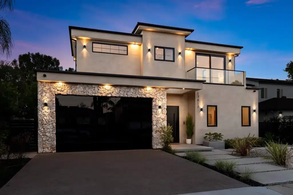 Contemporary custom home with illuminated facade