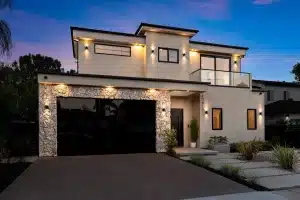 Contemporary custom home with illuminated facade