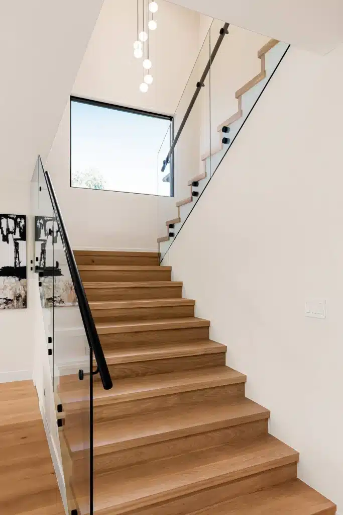 Modern wood staircase with glass railing