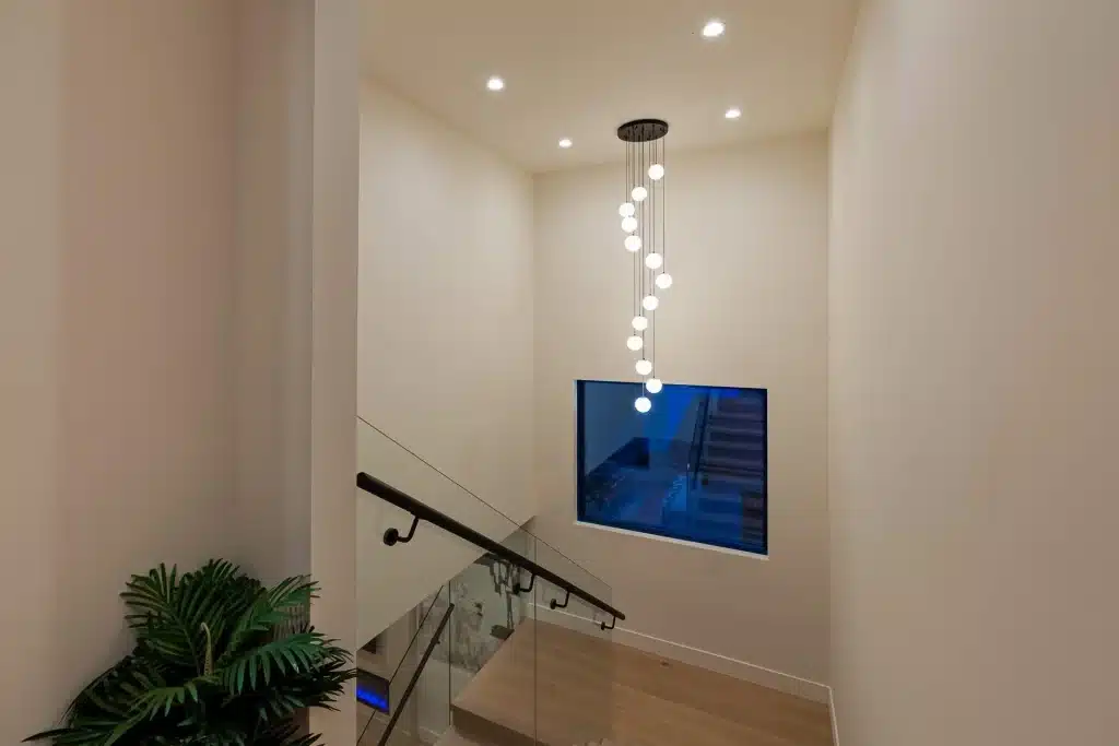 Modern staircase with designer pendant lighting