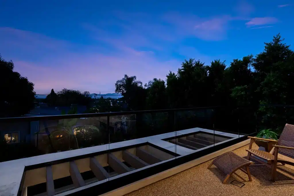 Modern balcony overlooking scenic evening landscape