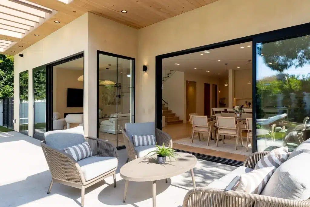 Covered patio with outdoor seating and open living room