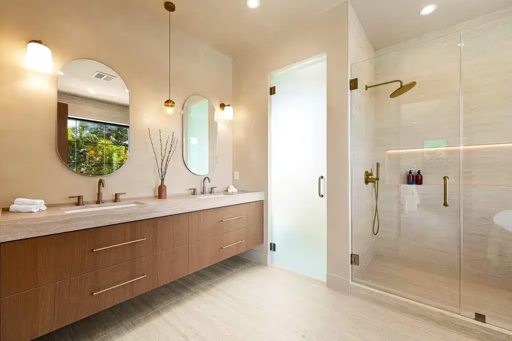Modern bathroom remodel with double vanity and glass shower