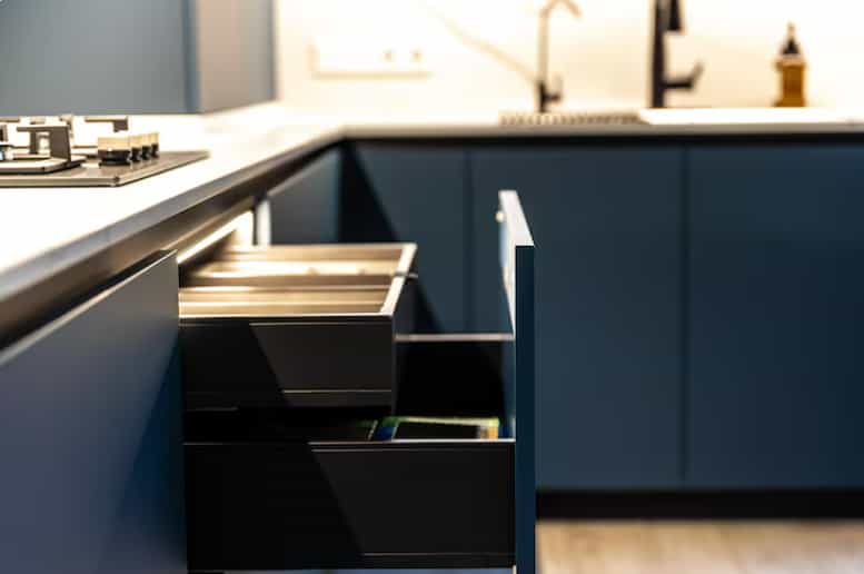 Modern kitchen drawer system with soft-close hardware and custom storage compartments.